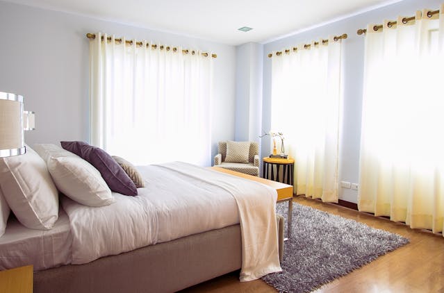 Bedroom with large windows in a Sanford rental property